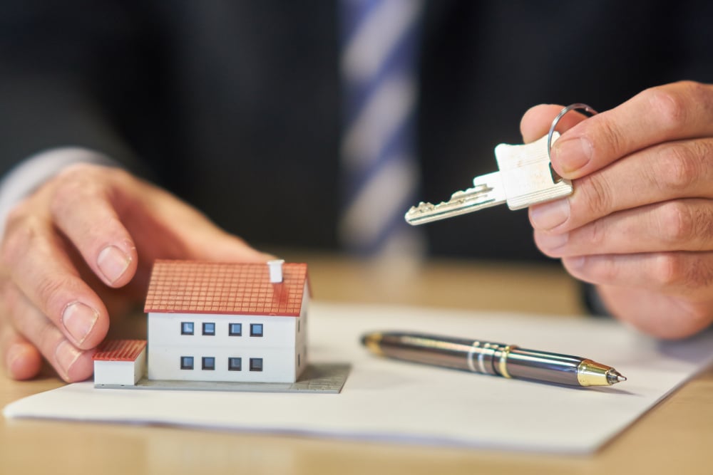 Purchase agreement for a new house highlighting the mandatory role of a qualified intermediary in a 1031 exchange for dealing with replacement property